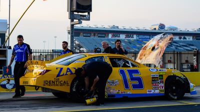 Zaxby's Race Car in the pit at Charlotte Motor Speedway with John Errington, Producer, by the car